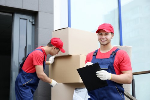 Professional flat removals in Queenspark with moving team handling boxes