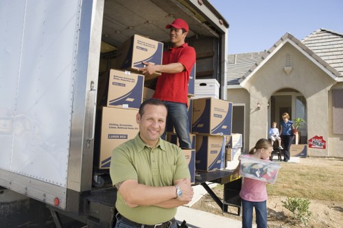 Queenspark movers organizing boxes and household items for transport