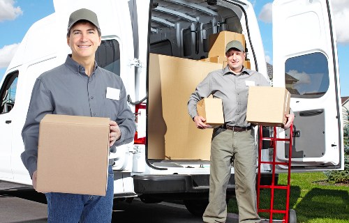 Driver inspecting loading restraints and vehicle condition